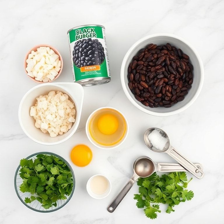 Overhead flat lay of raw ingredients for black bean burgers including black beans, onions, breadcrumbs, eggs, and spices on a white marble surface