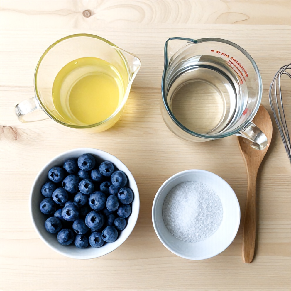 Blueberries, lemon juice, water, and stevia on a wooden surface
