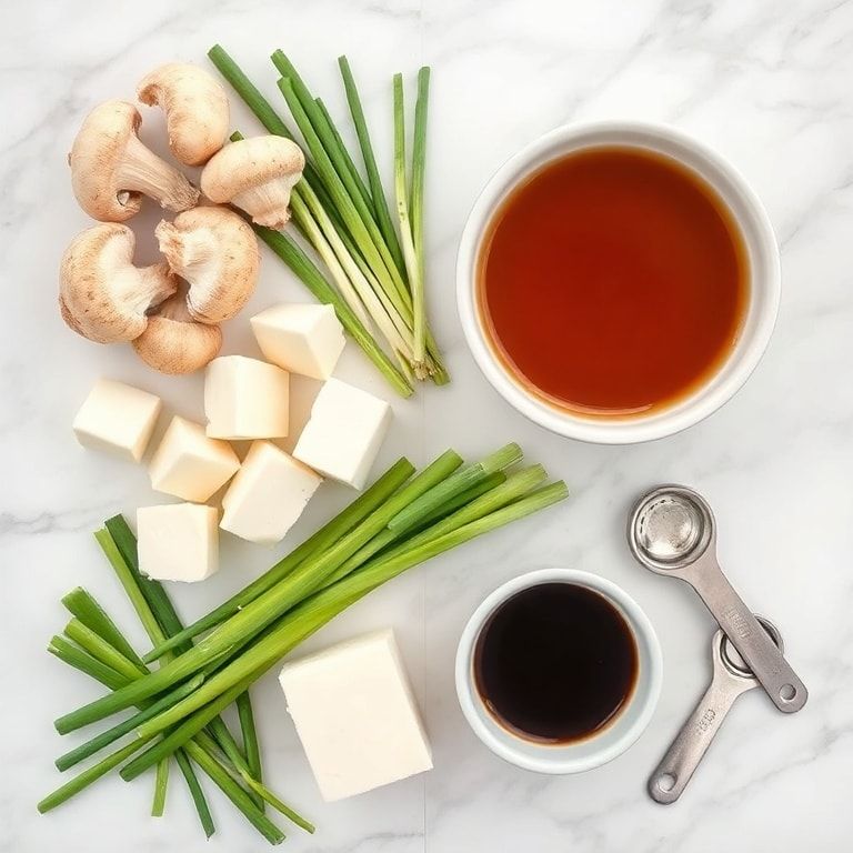 Raw ingredients for Japanese Shiitake Tofu Clear Soup including shiitake mushrooms, tofu, green onions, dashi broth, and soy sauce