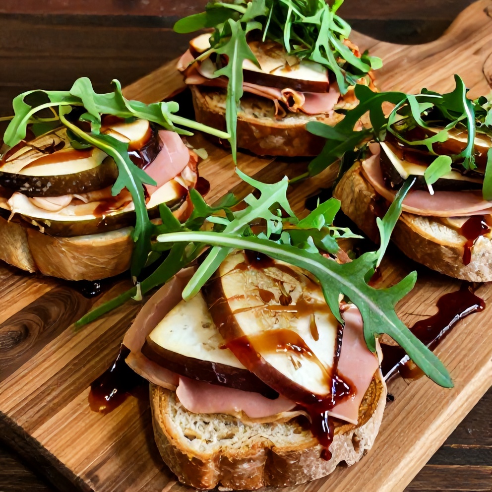 Plated Ham Brie Fig Sliders with arugula and balsamic glaze