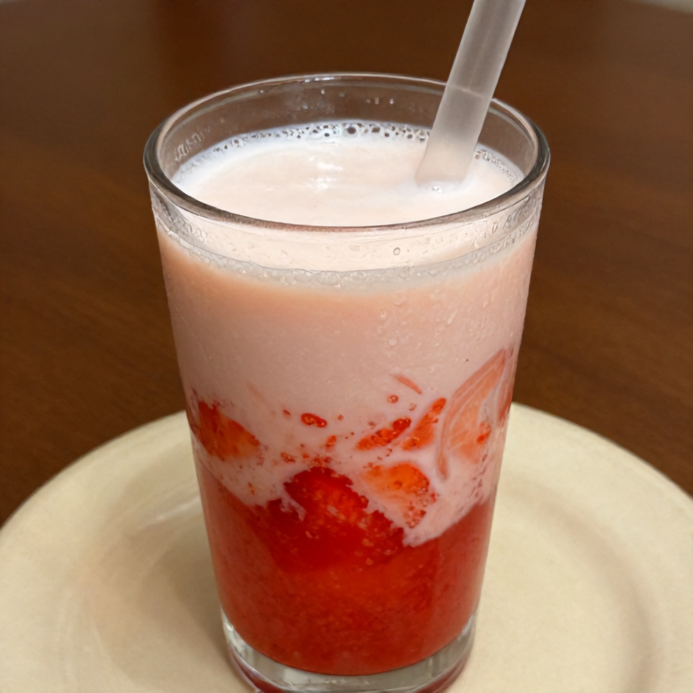 Glass of Korean strawberry milk with a straw